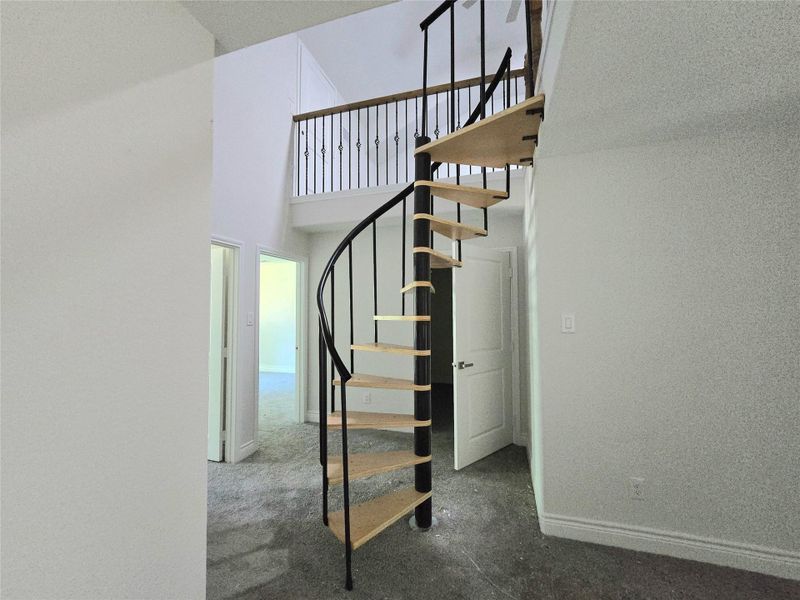Spiral staircase leading to 4th bedroom or flex room. Spiral staircase leading to 4th bedroom or flex room.