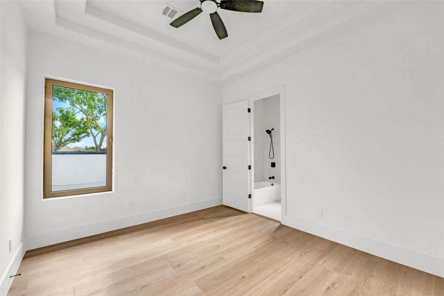 Bedroom 2 with en-suite bath and decorative ceiling