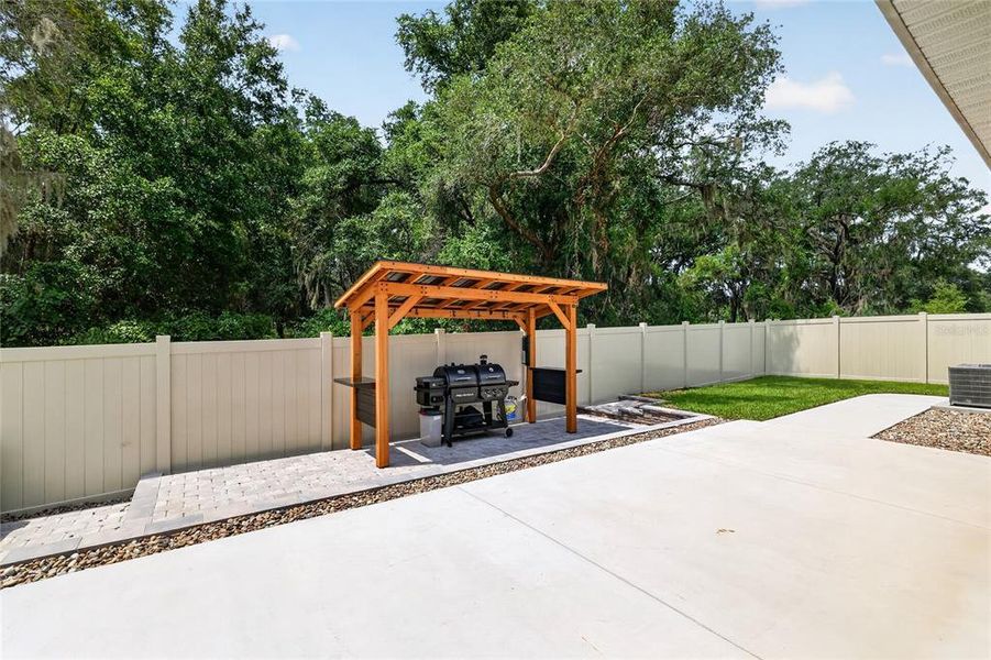 Exterior details and patio area of a home in Sunset Hills, Summerfield (Image 22).