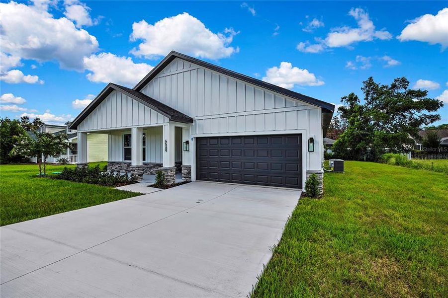 Front exterior of a new home in , Spring Hill, FL, highlighting curb appeal (Image 26).