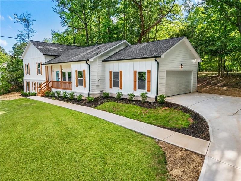 Front exterior of a new home in , Fairburn, GA, highlighting curb appeal (Image 17).
