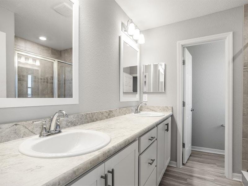 Your suite is complete with a walk-in wardrobe and a private en-suite bath with a tiled shower.