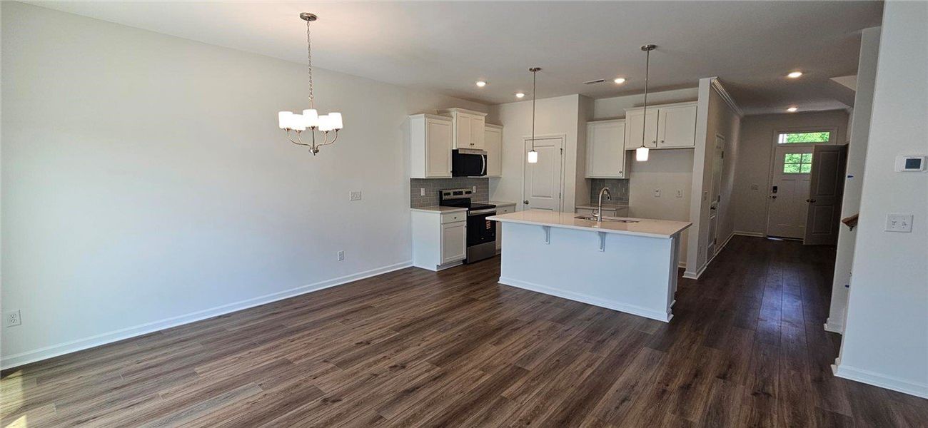 An open concept floor plan showcasing a spacious k An open concept floor plan showcasing a spacious k