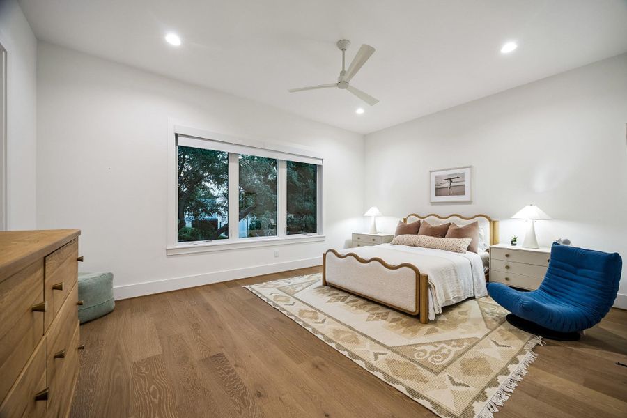 This secondary bedroom has a gorgeous view of the trees in the front yard.