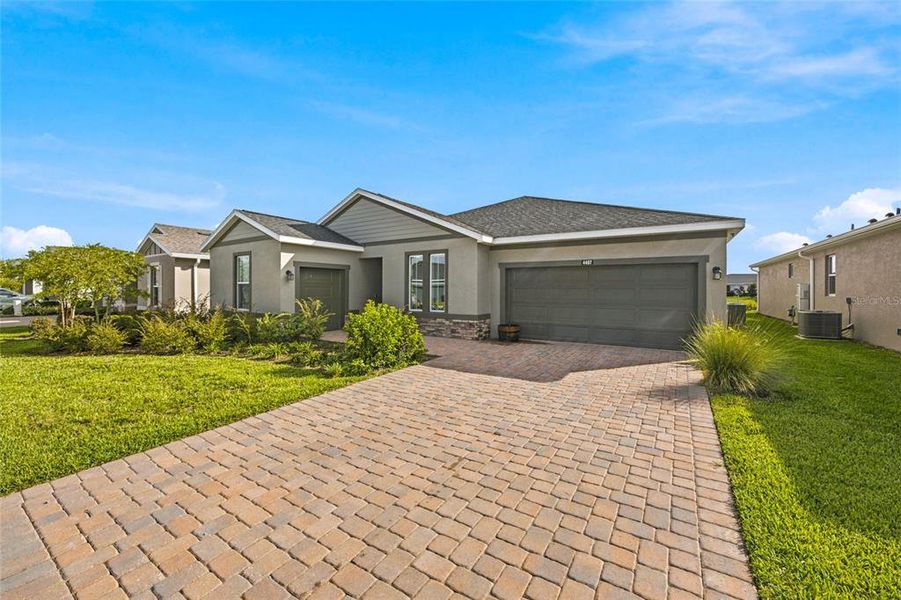 Front exterior of a new home in Ocala Preserve, Ocala, FL, highlighting curb appeal (Image 28).