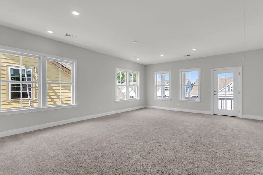 Spacious, unfurnished interior of a new home in Tidewater at Lakes of Cane Bay, Summerville (Image 29).