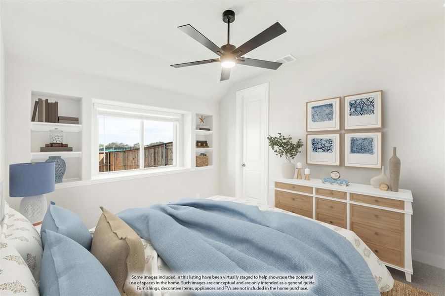 Bedroom with ceiling fan, built-in shelves, wood dresser, and blue bedding near a window Bedroom with ceiling fan, built-in shelves, wood dresser, and blue bedding near a window