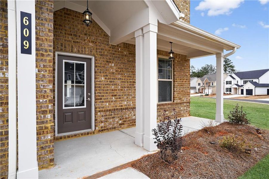 Exterior details and patio area of a home in The Fairways at Mirror Lake, Villa Rica (Image 19).