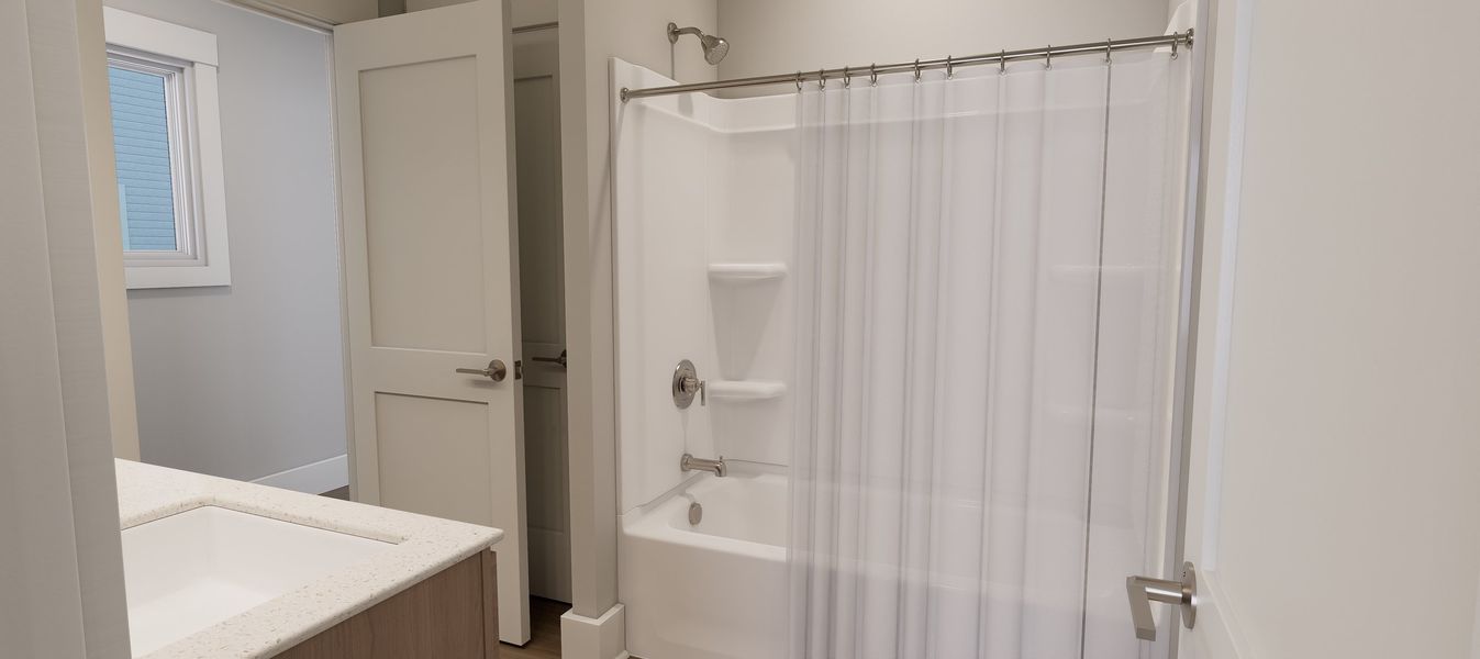 Representative furnished interior of a home built from the Bella by Baker Residential in Atwater Station - Village Collection, Fuquay Varina (Image 25).