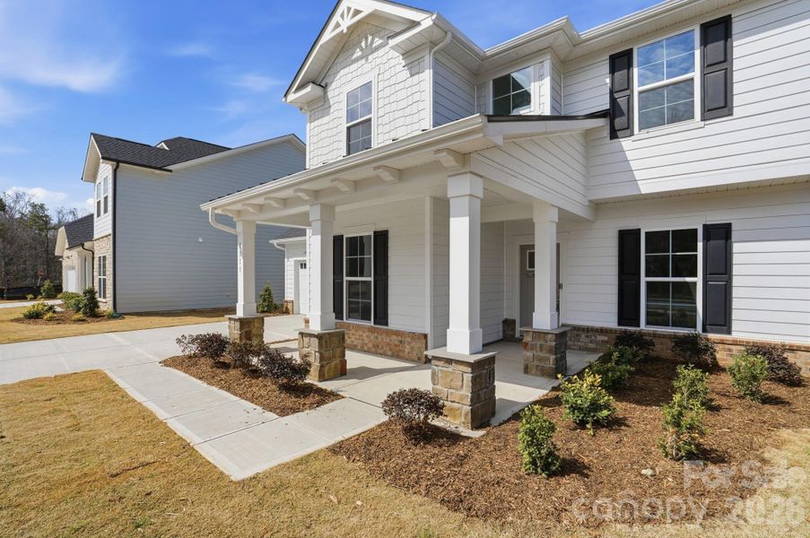 Exterior details and patio area of a home in Forest Creek, Waxhaw (Image 26).
