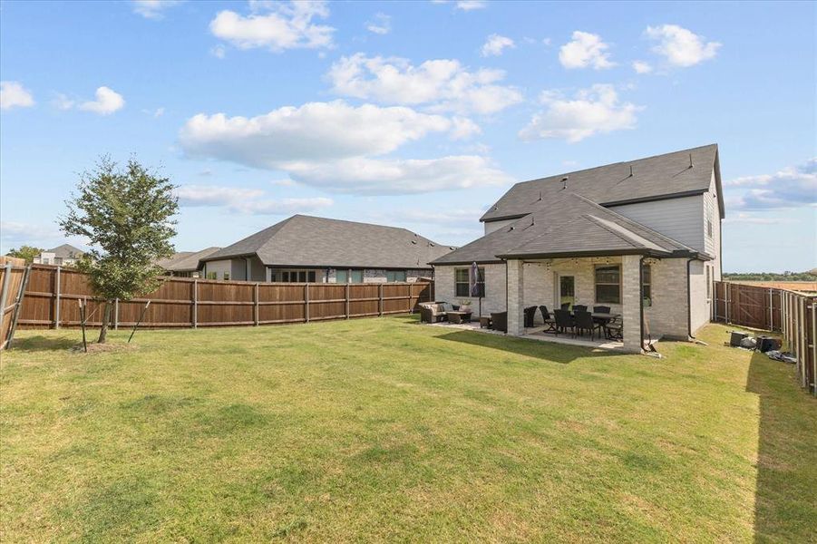 Exterior details and patio area of a home in DeBerry Reserve, Royse City (Image 3). Exterior details and patio area of a home in DeBerry Reserve, Royse City (Image 3).