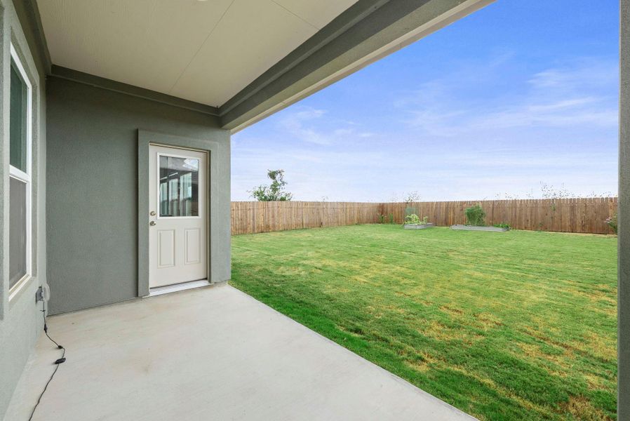 A spacious backyard with a new privacy fence, offering ample room for outdoor activities. A spacious backyard with a new privacy fence, offering ample room for outdoor activities.