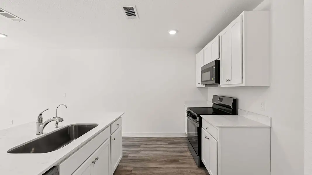 Furnished interior view inside a new home in Magnolia at the Bluffs Phase 3, Freeport (Image 4).