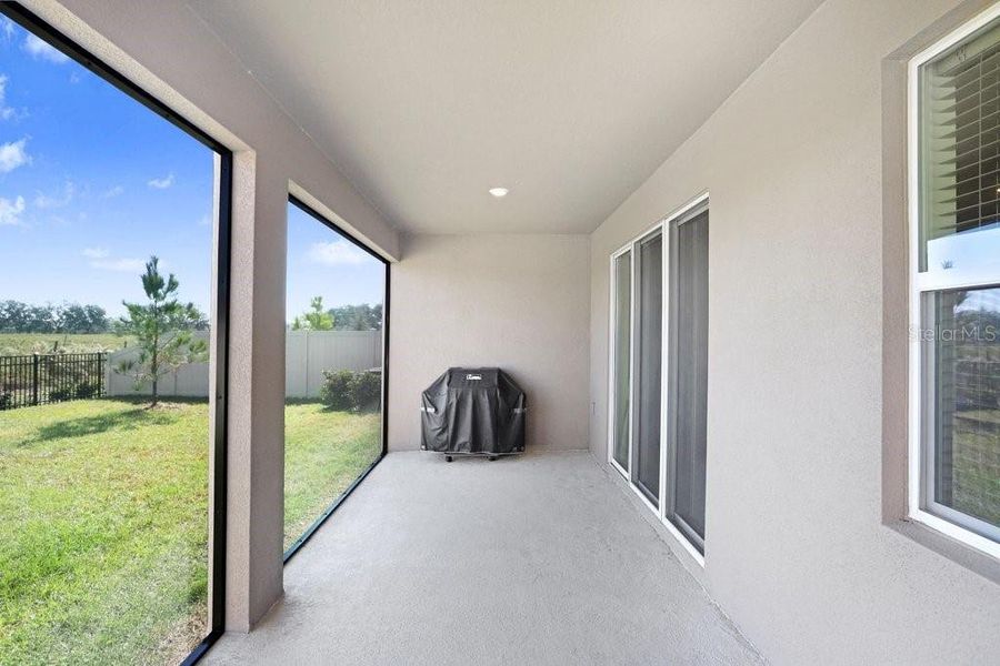 Exterior details and patio area of a home in Westgate at Avalon Park, Wesley Chapel (Image 25).