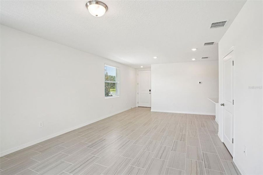 Spacious, unfurnished interior of a new home in Ridgehaven - Villas, Ormond Beach (Image 13).