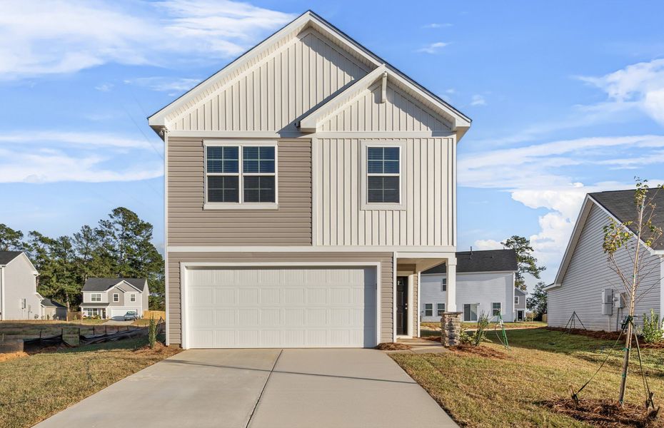 Front exterior of a new home in Willow Lake, Blythewood, SC, highlighting curb appeal (Image 2). Front exterior of a new home in Willow Lake, Blythewood, SC, highlighting curb appeal (Image 2).