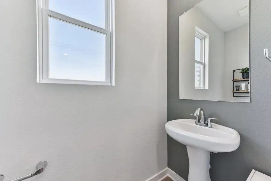 Furnished interior view inside a new home in Stallion Run, Buda (Image 8).