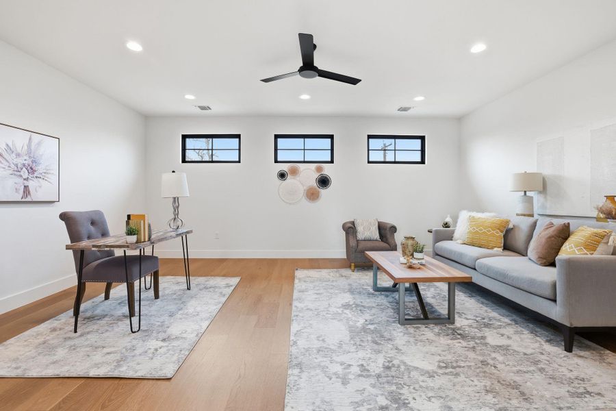Living room featuring recessed lighting, light wood-style flooring, healthy amount of natural light, ceiling fan, and a desk