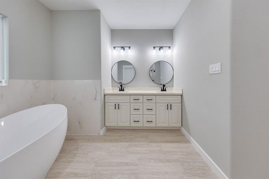 Primary bath featuring double sinks, offering ample space for two and adding convenience to your daily routine.