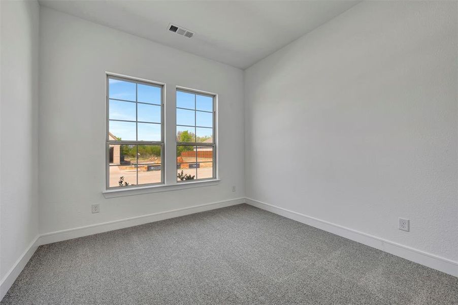 Spacious, unfurnished interior of a new home in Wellington, Haslet (Image 24).
