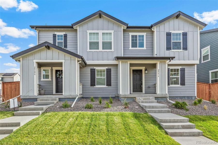 Front exterior of a new home in Sky Ranch Villas, Watkins, CO, highlighting curb appeal (Image 2).