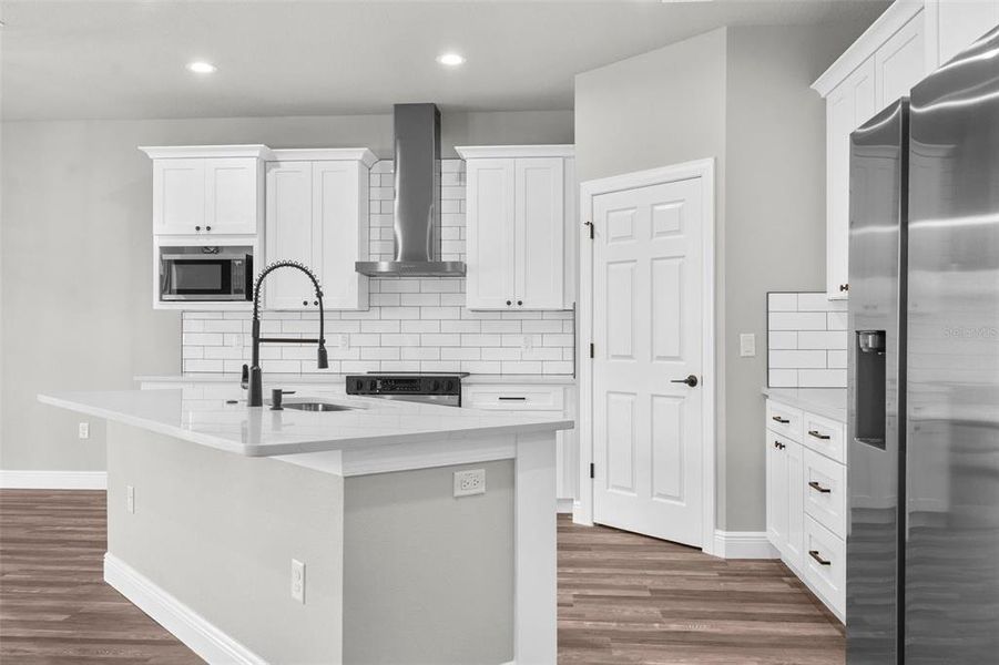 Upgraded cabinets and large modern island/breakfast bar.