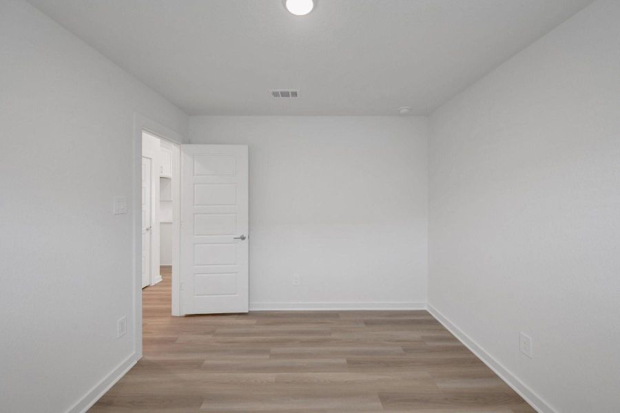 Spacious, unfurnished interior of a new home in Pinewood at Grand Texas, New Caney (Image 14).