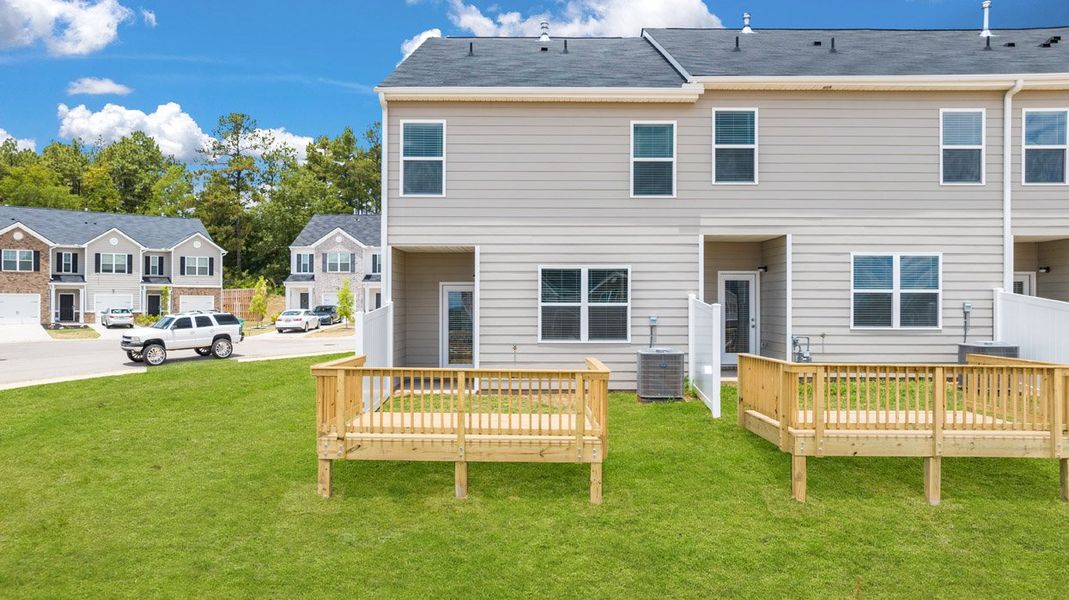 Front exterior of a new home in The Parish at Flat Rock Townhomes, Graniteville, SC, highlighting curb appeal (Image 22). Front exterior of a new home in The Parish at Flat Rock Townhomes, Graniteville, SC, highlighting curb appeal (Image 22).