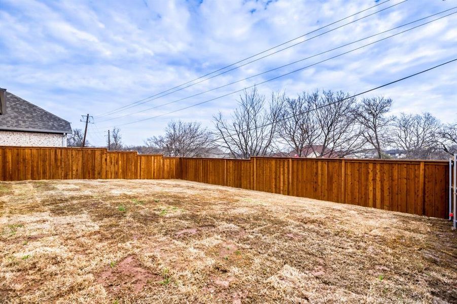 View of fenced backyard