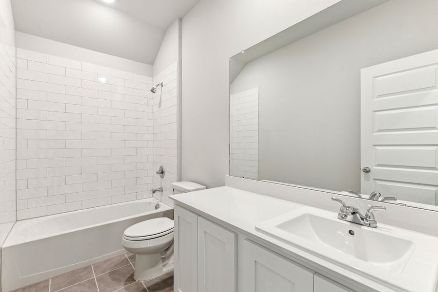 Bathroom in the Wimbledon home plan by Trophy Signature Homes – REPRESENTATIVE PHOTO