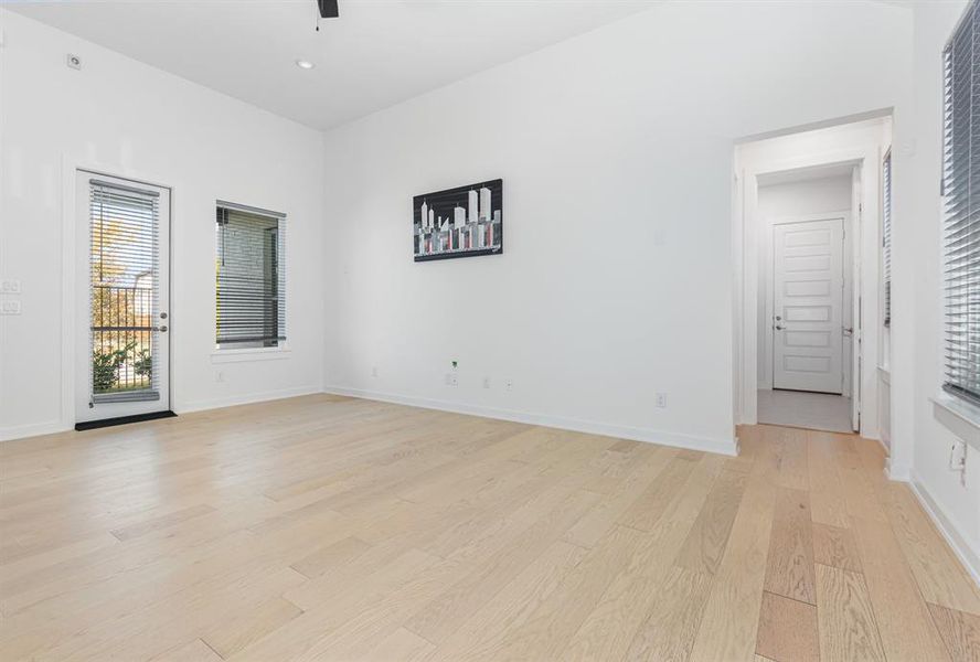 Spare room with light wood-type flooring, recessed lighting, and a ceiling fan Spare room with light wood-type flooring, recessed lighting, and a ceiling fan