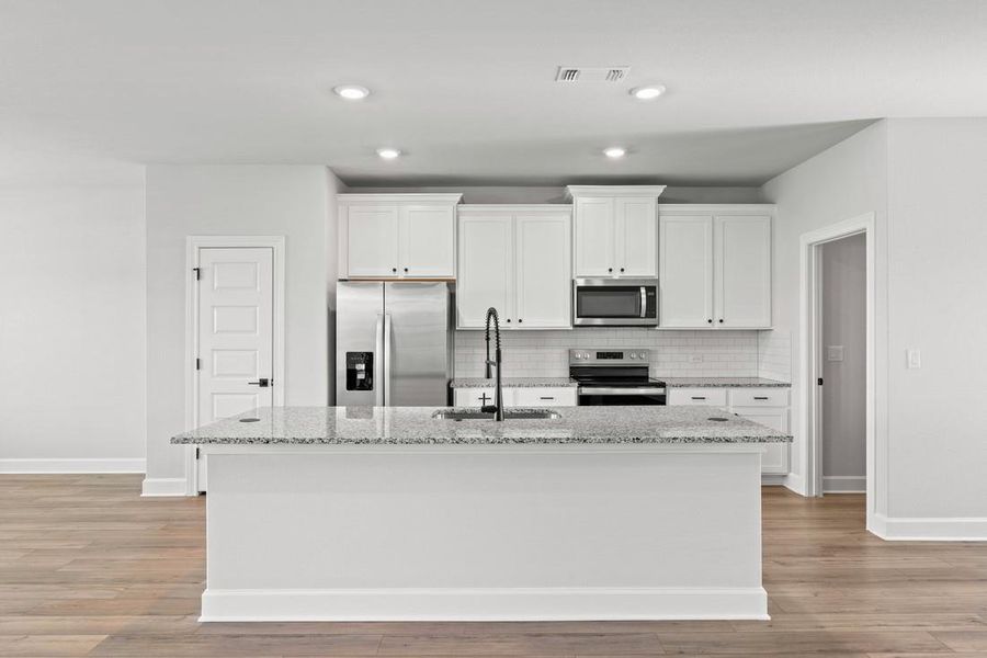 The island adds a fun twist to meal prep, making it a hub for both cooking and conversations.