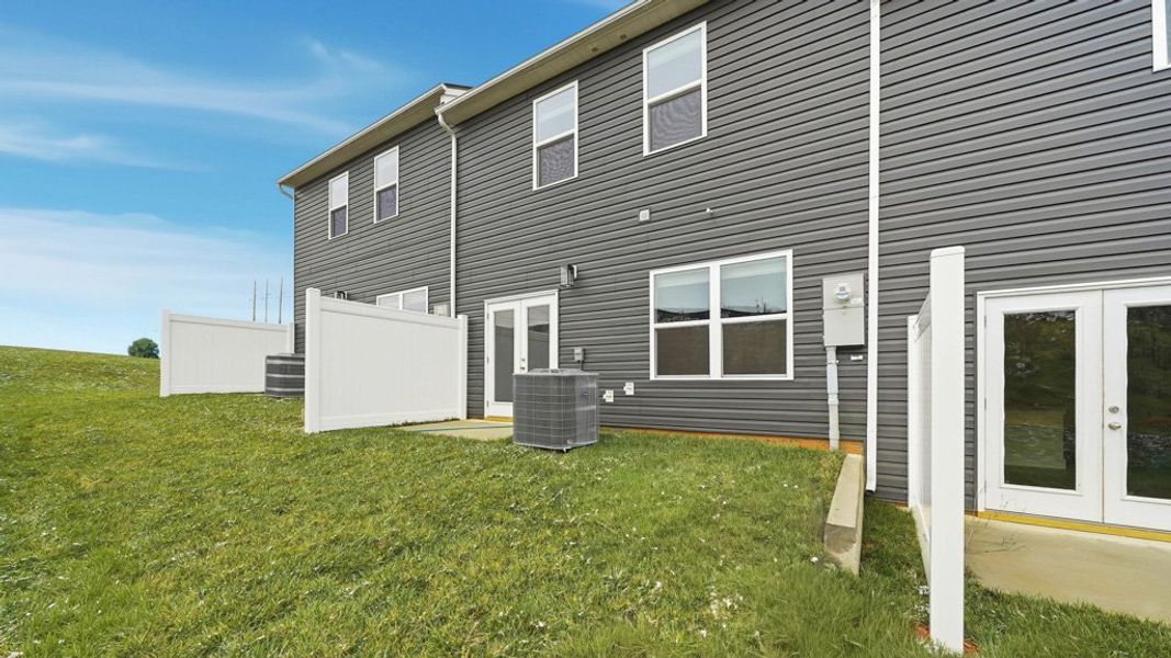 Exterior details and patio area of a home in The Arbor Townhomes, Kingsport (Image 4).