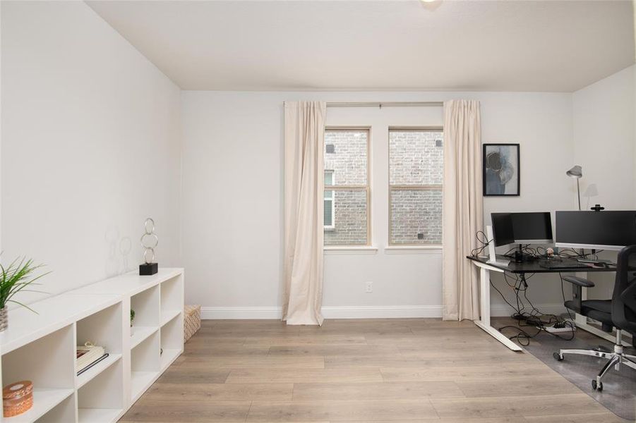 Featuring solid French doors and a private location within the home, this versatile space is ideal for a home office, study area, hobby room, or library. Featuring solid French doors and a private location within the home, this versatile space is ideal for a home office, study area, hobby room, or library.