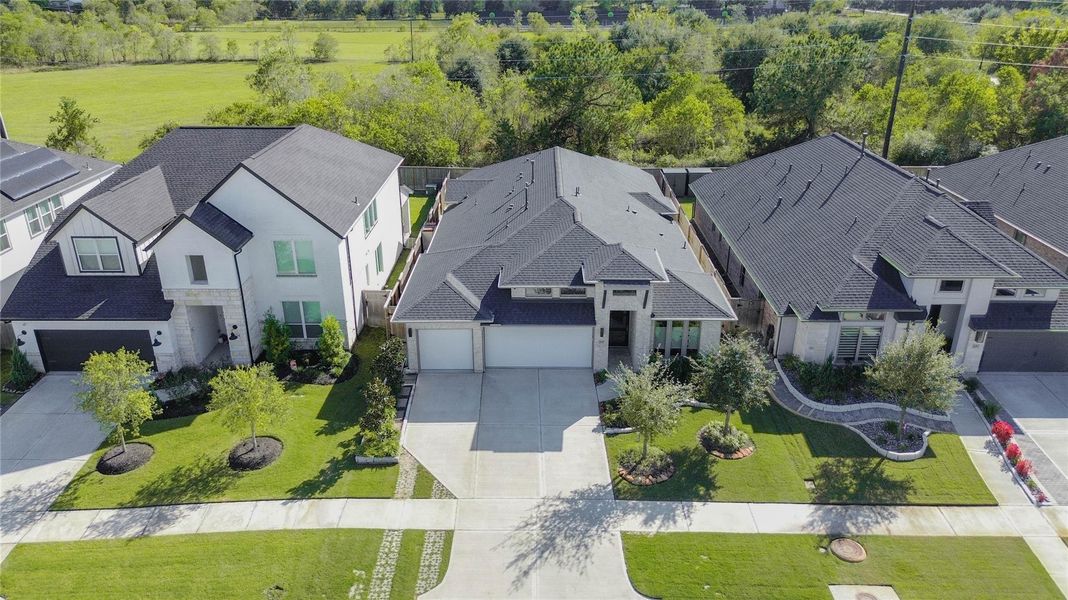 Front exterior of a new home in Cross Creek West 55', Fulshear, TX, highlighting curb appeal (Image 21).