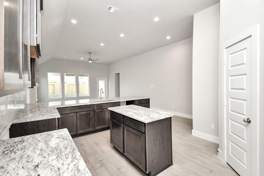 Example of completed home with similar plan. As-built colors and selections may vary.