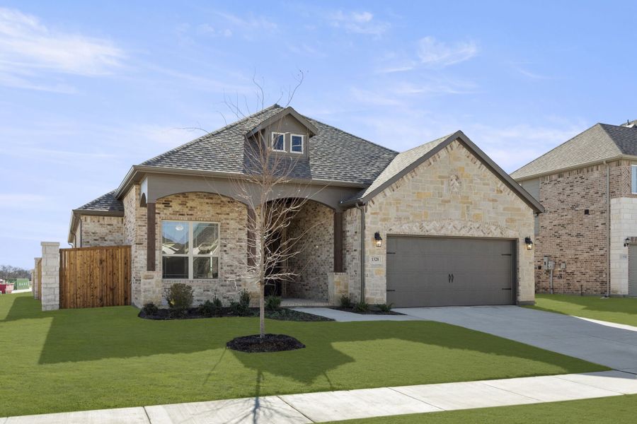 Front exterior of a new home in Anna Town Square, Anna, TX, highlighting curb appeal (Image 2). Front exterior of a new home in Anna Town Square, Anna, TX, highlighting curb appeal (Image 2).