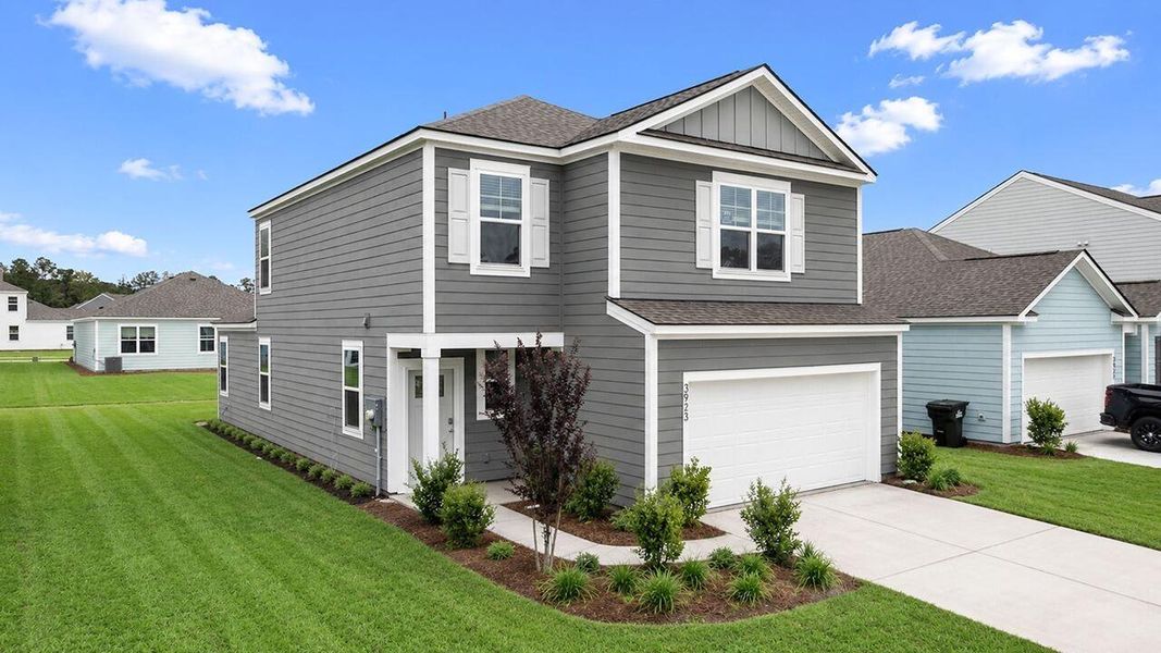Front exterior of a new home in Hillcrest, Ravenel, SC, highlighting curb appeal (Image 2). Front exterior of a new home in Hillcrest, Ravenel, SC, highlighting curb appeal (Image 2).
