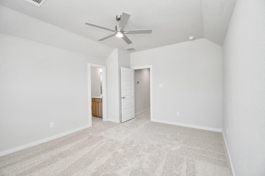 Generously sized secondary bedrooms featuring spacious closets, soft and inviting carpeting underfoot, large windows allowing plenty of natural light, and the added touch of privacy blinds for your personal retreat. Sample photo of completed home with similar floor plan. Actual colors and selections may vary.