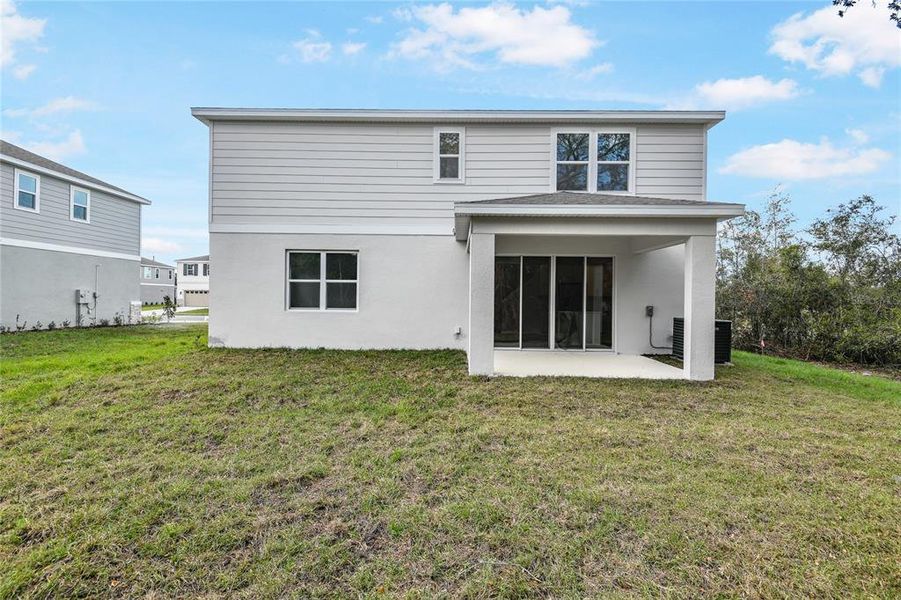 Exterior details and patio area of a home in Seasons at Summit Ridge, Apopka (Image 3).
