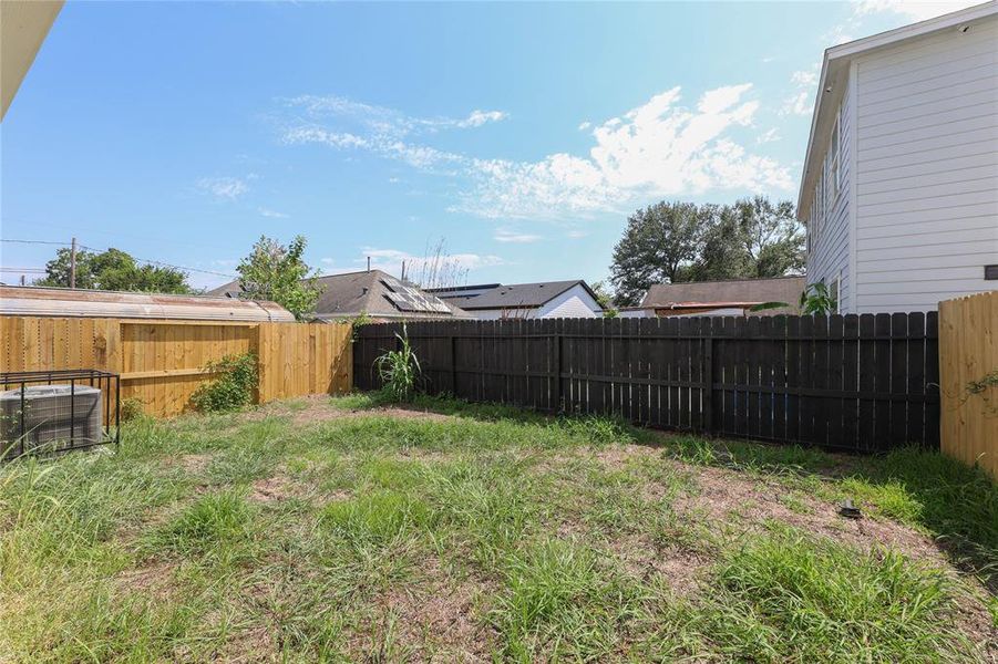 Back yard offers potential for home garden or space to play!