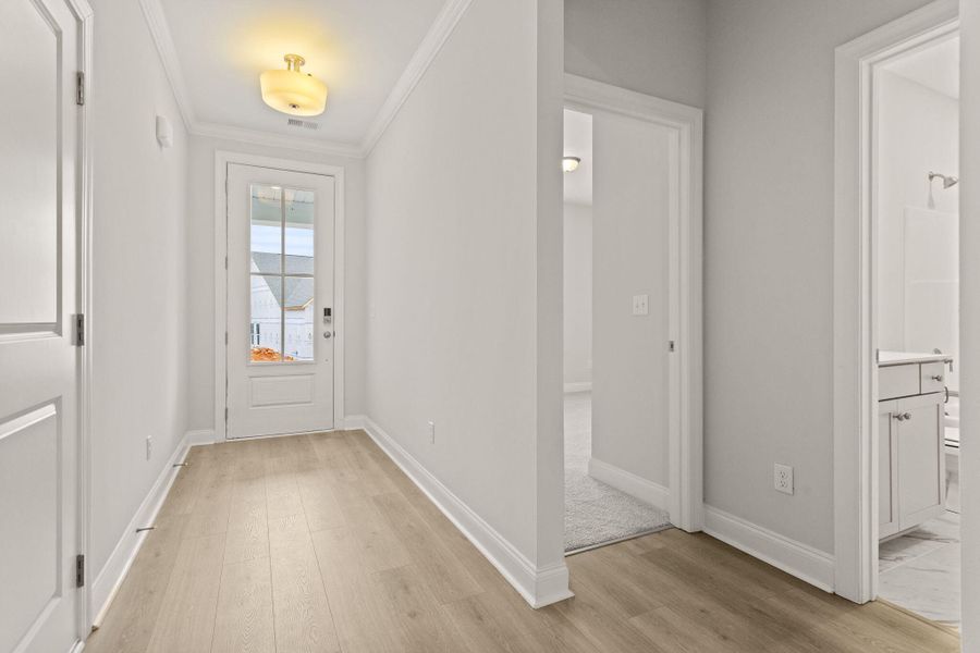 Spacious, unfurnished interior of a new home in Tidewater at Lakes of Cane Bay, Summerville (Image 13).