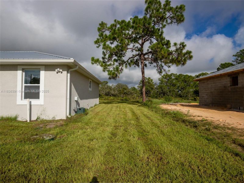 Front exterior of a new home in , Lake Placid, FL, highlighting curb appeal (Image 25).