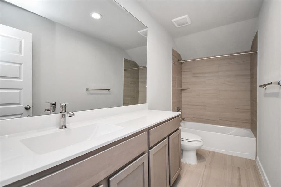 Secondary bath. Sample photo of completed home with similar floor plan. As-built interior colors and selections may vary.