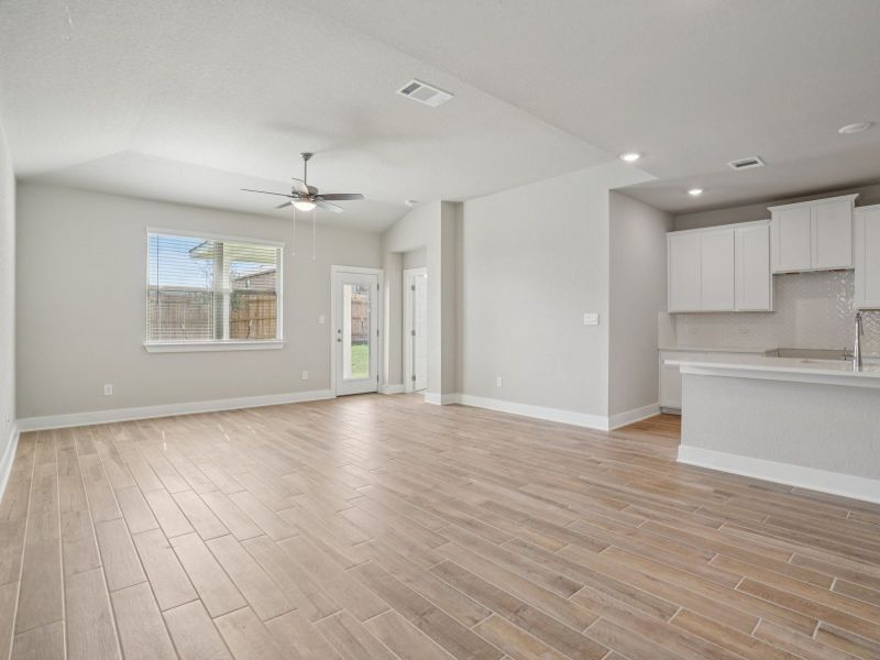 Kitchen, Living & Dining in the San Jacinto floorplan at a Meritage Homes community. Kitchen, Living & Dining in the San Jacinto floorplan at a Meritage Homes community.