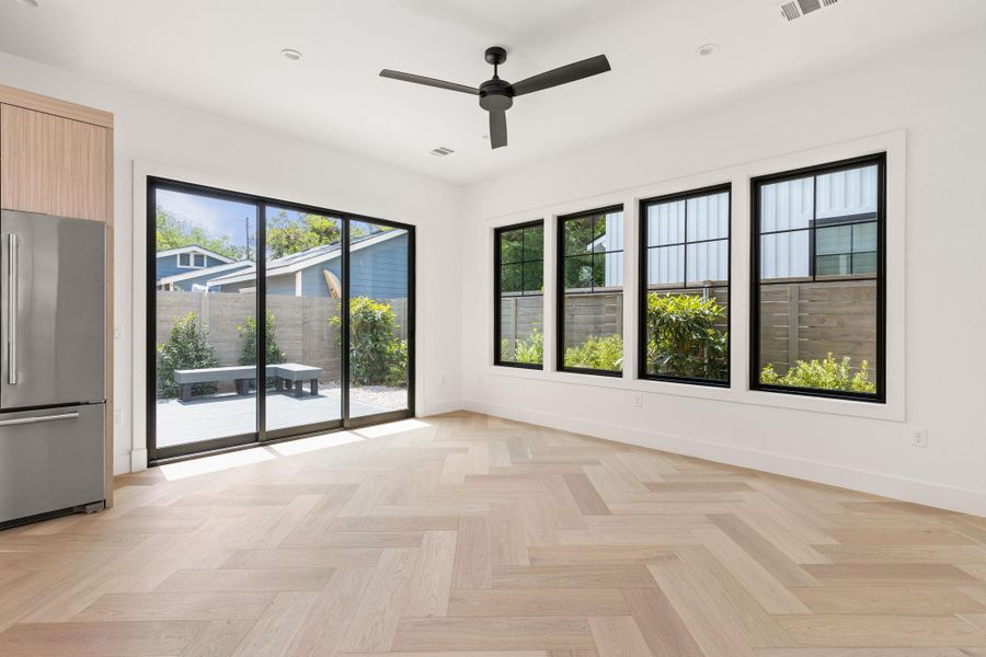 Unfurnished room featuring plenty of natural light, a ceiling fan, and recessed lighting Unfurnished room featuring plenty of natural light, a ceiling fan, and recessed lighting