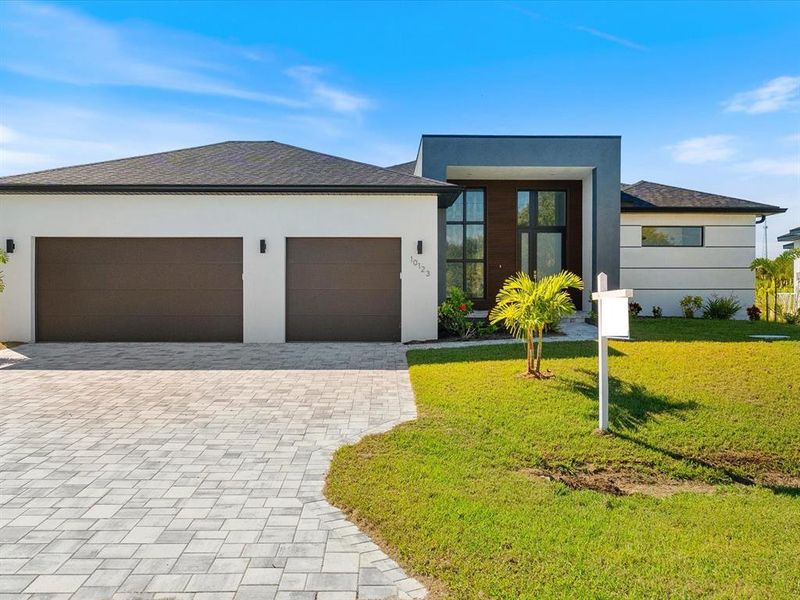 Front exterior of a new home in , Port Charlotte, FL, highlighting curb appeal (Image 2). Front exterior of a new home in , Port Charlotte, FL, highlighting curb appeal (Image 2).