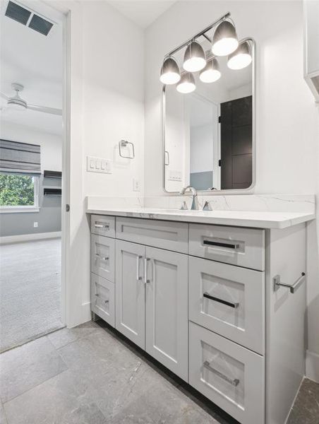 Bathroom with vanity and tile patterned flooring