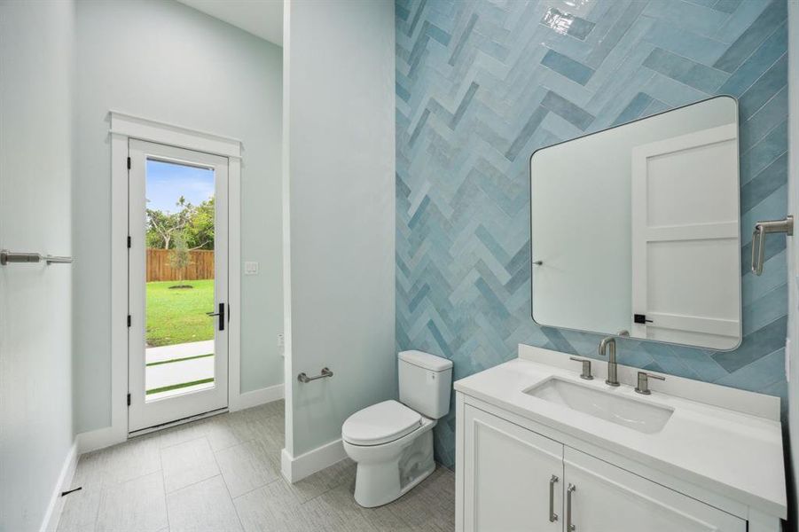 Half Bath off Back Patio; Beautiful Floor to Ceiling Tile; Cubby and MUD Room Stile storage