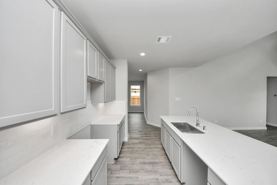 The extended counter area adds both practicality and style, making meal preparation a breeze. Every detail is thoughtfully designed to enhance the kitchen's functionality and aesthetic appeal. The extended counter area adds both practicality and style, making meal preparation a breeze. Every detail is thoughtfully designed to enhance the kitchen's functionality and aesthetic appeal.